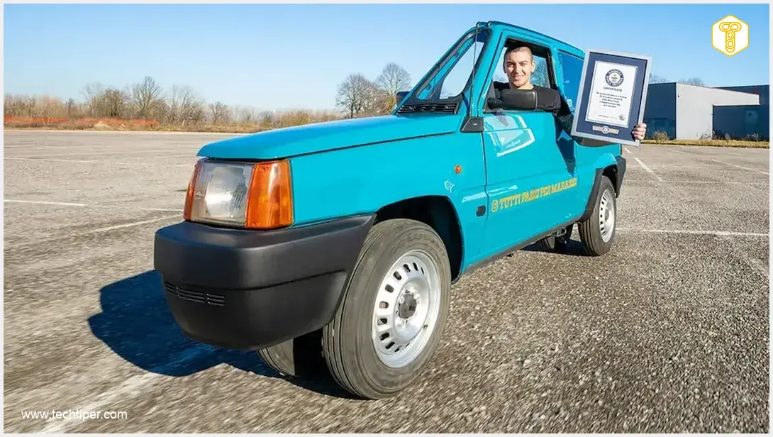 Image showing Andrea Marazzi with the world's narrowest Fiat Panda